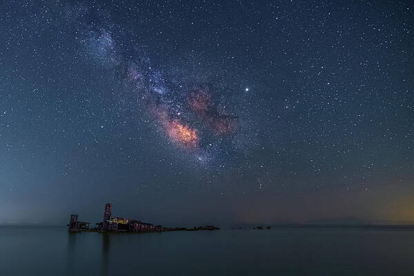 Milky Way Poster featuring the photograph The Milky Way over a Shipwreck by Alexios Ntounas