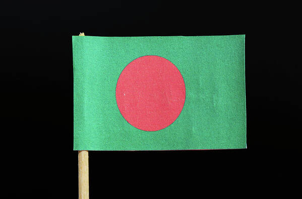  Bangladesh Poster featuring the photograph The national flag of Bangladesh on toothpick on black background. A red disc on a green field by Vaclav Sonnek