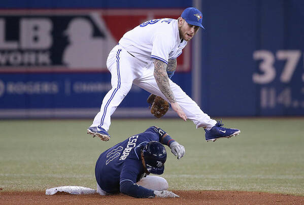 Double Play Poster featuring the photograph Yunel Escobar and Brett Lawrie by Tom Szczerbowski