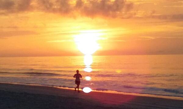 Myrtle Beach Poster featuring the photograph Runner at Sunrise by Sarah Gage