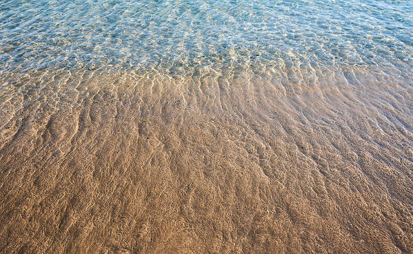 Abstract Poster featuring the photograph Seashore clear water with sandy beach for background by Michalakis Ppalis