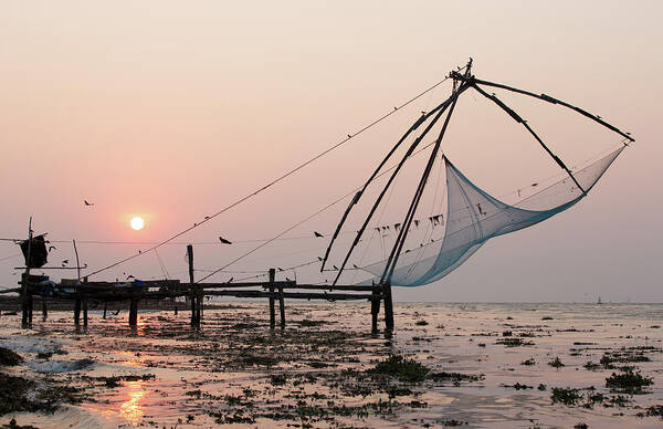 Pier And Fishing Nets On Beach At Sunset, Kochi, Kerala, India