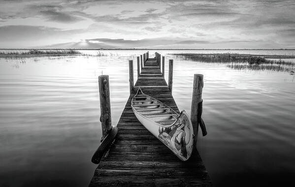 Black Poster featuring the photograph Canoe on the Dock Black and White by Debra and Dave Vanderlaan