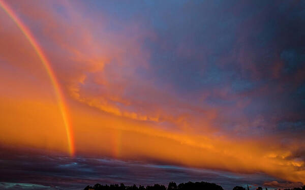 Rainbow Poster featuring the photograph Ethereal Clouds and Rainbow by Greg Reed