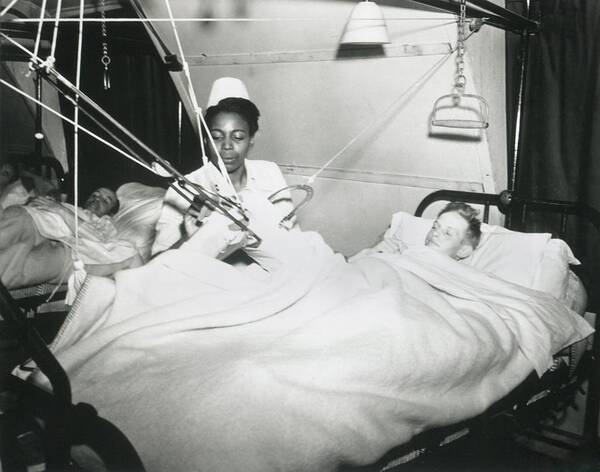 History Poster featuring the photograph African America U.s. Army Nurse Treats by Everett