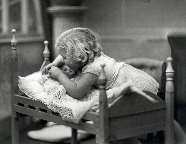 1 Person Poster featuring the photograph Girl Puts Doll To Bed by Underwood Archives