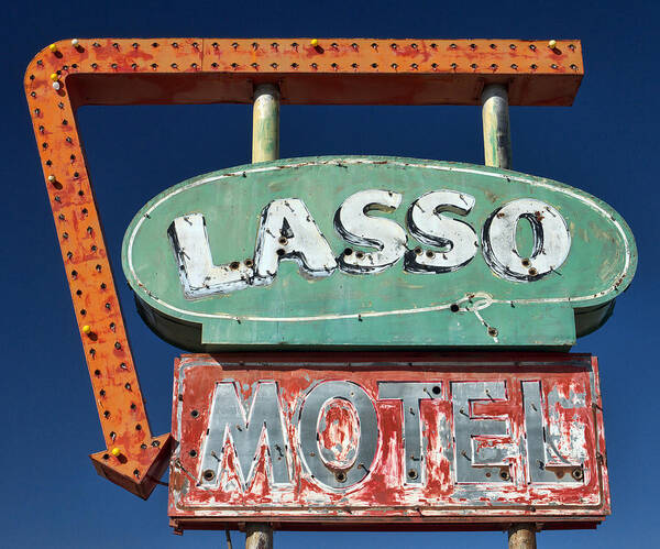 Route 66 Poster featuring the photograph Lasso Motel Sign on Route 66 by Carol Leigh