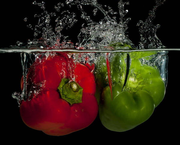 Splashing Peppers Poster featuring the photograph Splashing peppers by Mike Santis