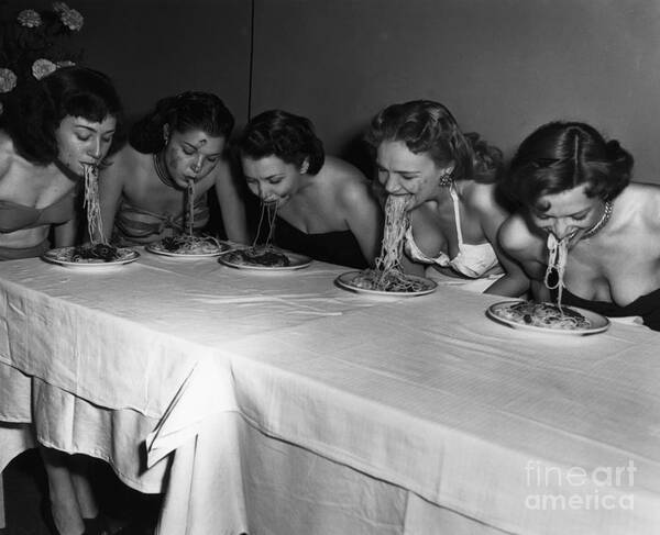 Event Poster featuring the photograph Broadway Showgirls Eating Spaghetti by Bettmann