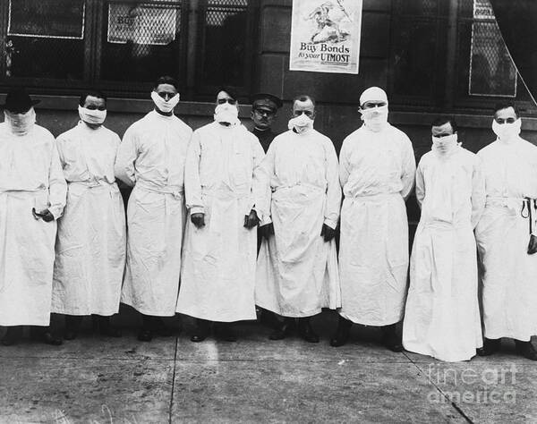 Protective Face Mask Poster featuring the photograph Doctors Wear Surgical Gowns And Masks by Bettmann