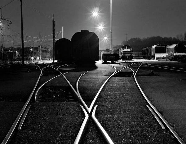 Pole Poster featuring the photograph Train And Rail Shapes In The Night by Nicola Filardi