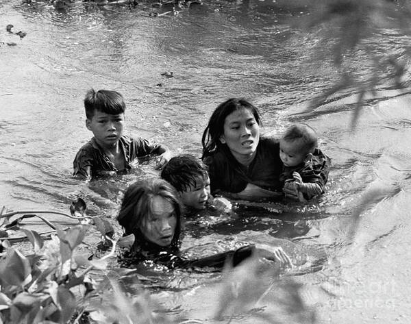 Mid Adult Women Poster featuring the photograph Vietnamese Mother And Children Flee by Bettmann