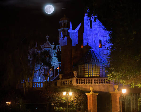 Magic Kingdom Poster featuring the photograph A Haunted Mansion Moon by Mark Andrew Thomas