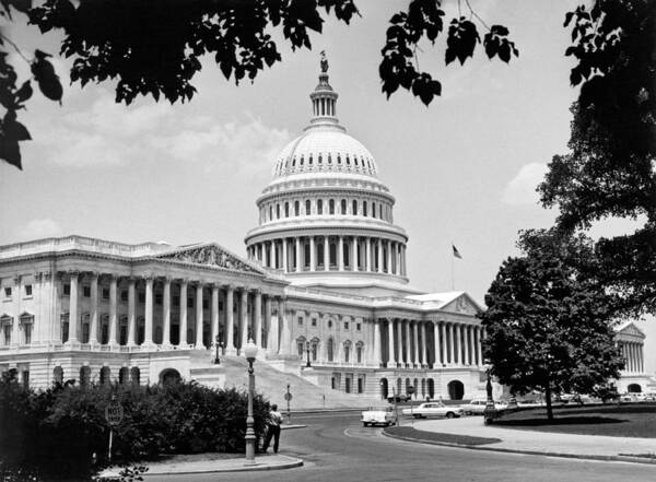 1 Person Poster featuring the photograph The Capitol Building #1 by Underwood Archives