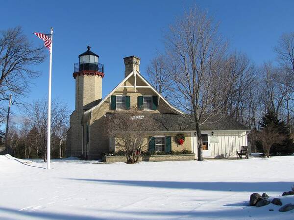 Winter Poster featuring the photograph McGulpin Point Lighthouse in Winter by Keith Stokes