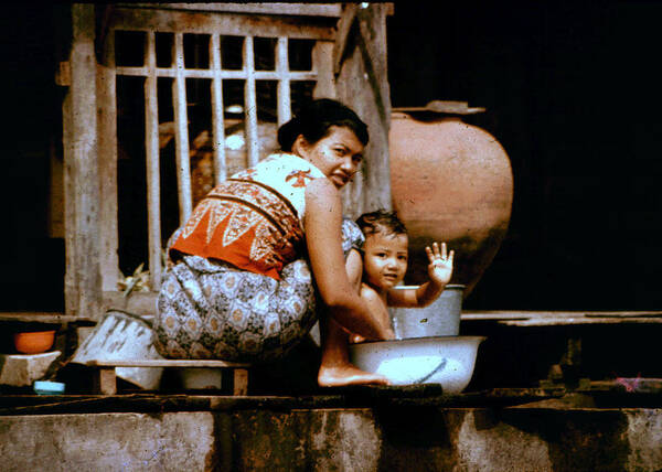 Mother And Child Poster featuring the photograph Bath in a Bucket by John Warren