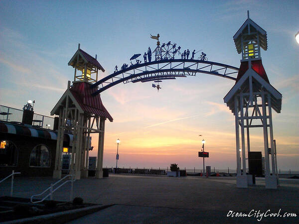 Sunrise Poster featuring the photograph Sunrise at the Ocean City Arch by Robert Banach