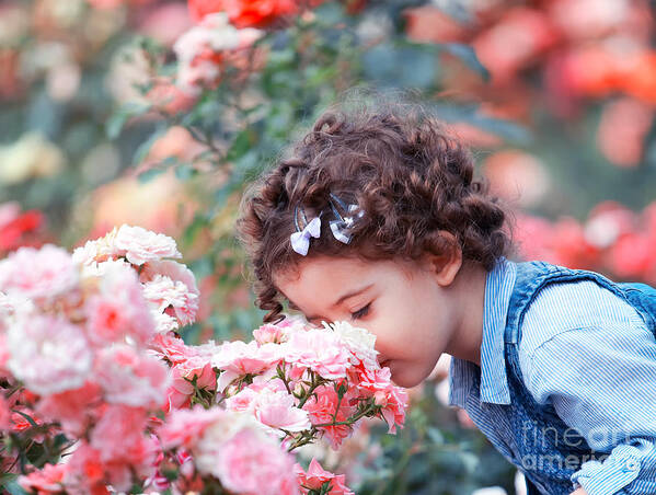 Baby Girl Poster featuring the photograph Baby girl smelling pink roses by Gabriela Insuratelu