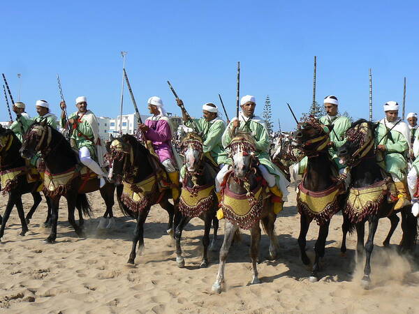 Essaouira Poster featuring the photograph Bedouins in Essaouira by Alan Pillant