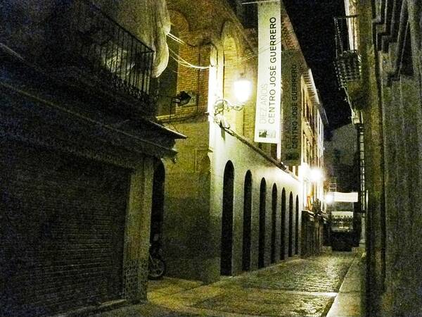 Night Poster featuring the photograph Granada Stone Paved Side Street Lamp at Night by John Shiron