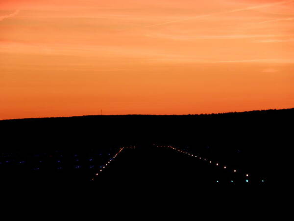 Airport Poster featuring the photograph Runway At Sundown by Kim Galluzzo