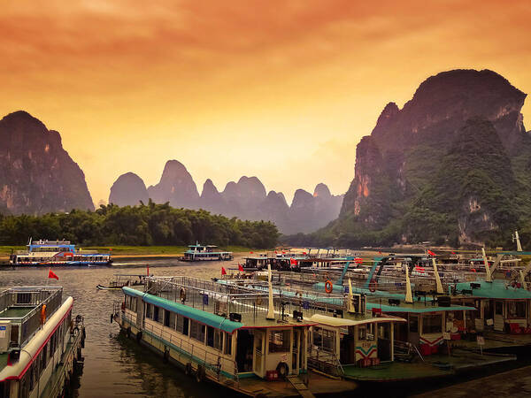 Sunset Poster featuring the photograph Boat watching the sun goes down-China Guilin scenery-Lijiang River in Yangshuo by Artto Pan