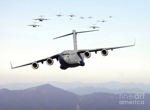 Color Image Poster featuring the photograph A Formation Of 17 C-17 Globemaster IIis by Stocktrek Images