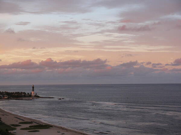 Lighthouse Poster featuring the photograph Lighthouse Peach Sunset by Corinne Carroll