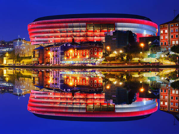 San Poster featuring the photograph San Mames Stadium At Night With Water Reflections by Mikel Martinez de Osaba