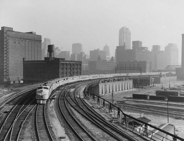 Diesel Engines Poster featuring the photograph Streamlined Diesel Locomotive Passes Through Major City by Chicago and North Western Historical Society