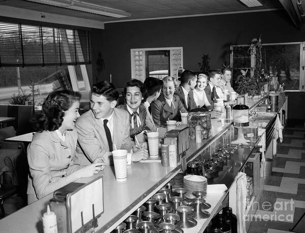 1950s Poster featuring the photograph Teens At Soda Fountain Counter, C.1950s by H. Armstrong Roberts/ClassicStock