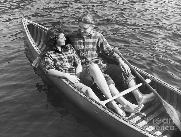 People Poster featuring the photograph Couple Canoeing by Bettmann