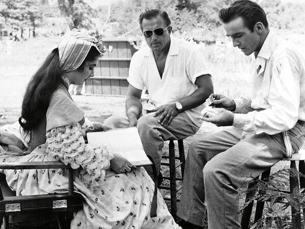 Edward Dmytryk Poster featuring the photograph EDWARD DMYTRYK , ELIZABETH TAYLOR and MONTGOMERY CLIFT in RAINTREE COUNTY -1957-. by Album