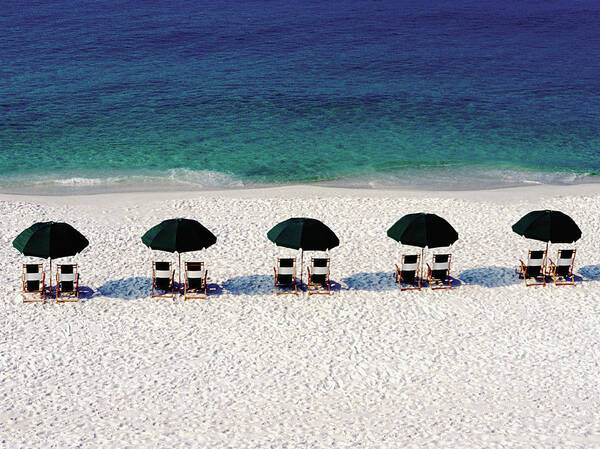 Five Objects Poster featuring the photograph Five Umbrellas With Chairs On Beach by Medioimages/photodisc