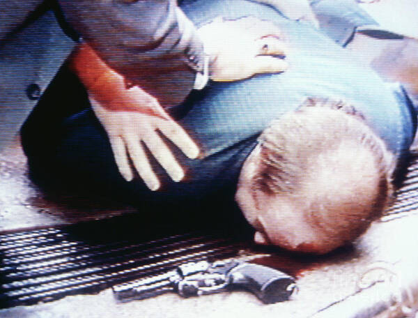 1980-1989 Poster featuring the photograph Jim Brady Lying On Sidewalk by Bettmann