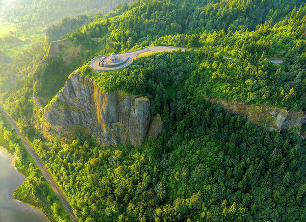 Golden Hour Poster featuring the photograph Golden hour aerial view of Vista House in Columbia River Gorge with sun revealing mossy cliffs by Chris Anson