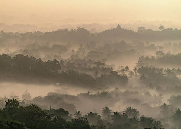 Borobudur Poster featuring the photograph Borobudur temple during sunrise by Anges Van der Logt