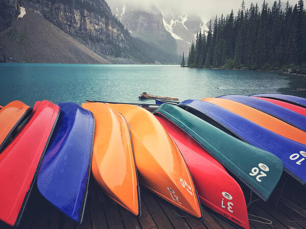 Moraine Lake Poster featuring the photograph Colorful Canoes #1 by Jonathan Nguyen