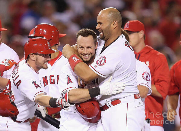Ninth Inning Poster featuring the photograph Johnny Giavotella, Albert Pujols, and Daniel Nava by Stephen Dunn