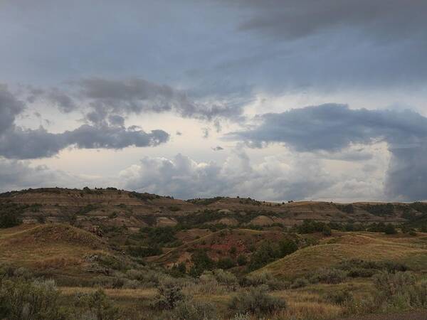 Clouds Poster featuring the photograph Stormy Badlands by Amanda R Wright