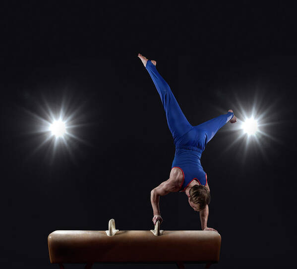 Focus Poster featuring the photograph Male Gymnast Doing Handstand On Pommel by Mike Harrington
