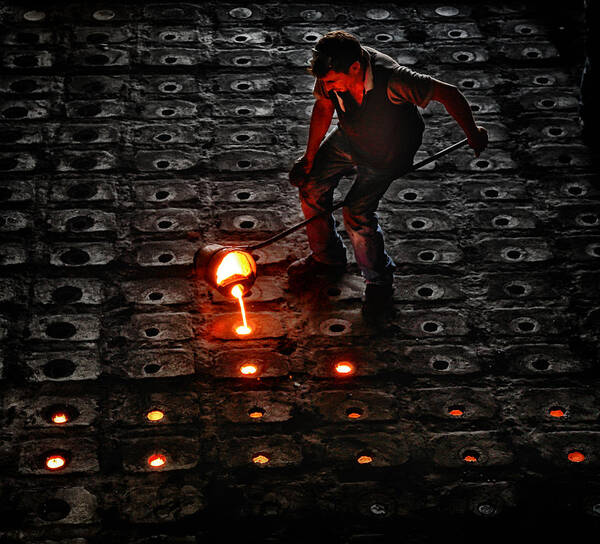 Glow Poster featuring the photograph Metalworker by Murat Yilmaz