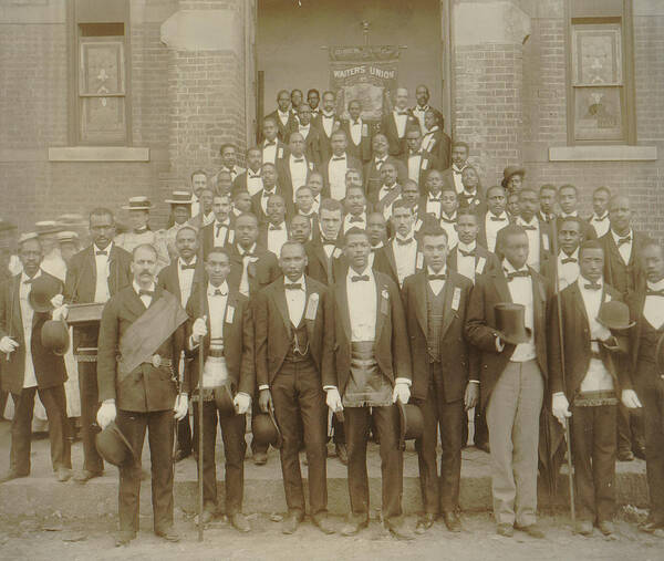 Negroes Poster featuring the painting African American men posed at entrance to building, some with derbies and top hats, and banner labeled Waiters Union in Georgia by Unknown