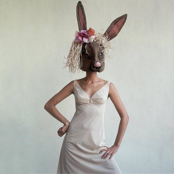 Fashion Poster featuring the photograph A Woman Wearing A Rabbit Mask by Gianni Penati