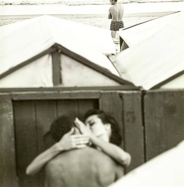 Outdoors Poster featuring the photograph Couple Kissing By A Model Wearing Westwood Trunks by Chadwick Hall