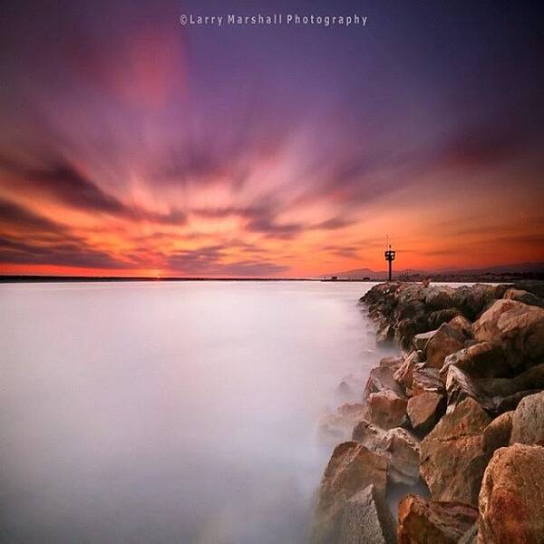  Poster featuring the photograph Long Exposure Sunset Shot At A Rock by Larry Marshall