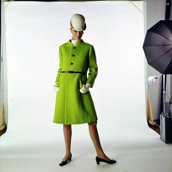 Fashion Poster featuring the photograph Model Wearing A Dan Millstein Coat by Bert Stern