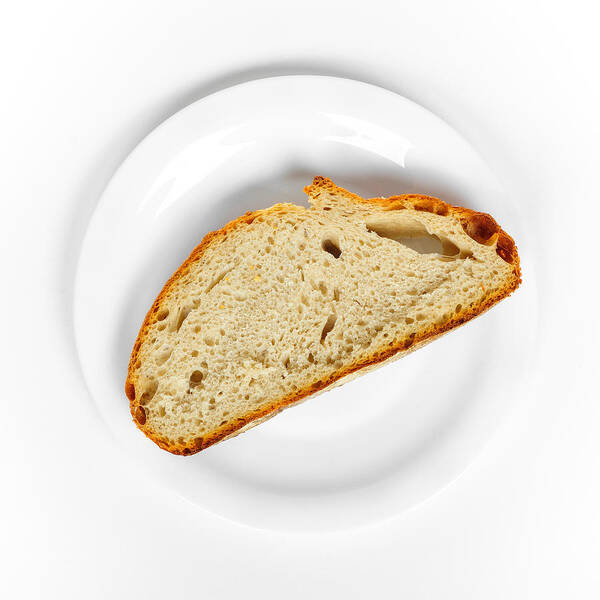 Bread Poster featuring the photograph One slice of bread white plate and background by Matthias Hauser