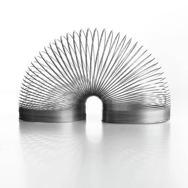 Slinky Poster featuring the photograph Slinky Spring by Science Photo Library