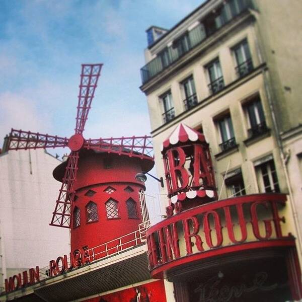 #windmill #france #paris #moulinrouge #red #summer #icon #landmark #architecture #building #famous Poster featuring the photograph The red windmill by Brad James